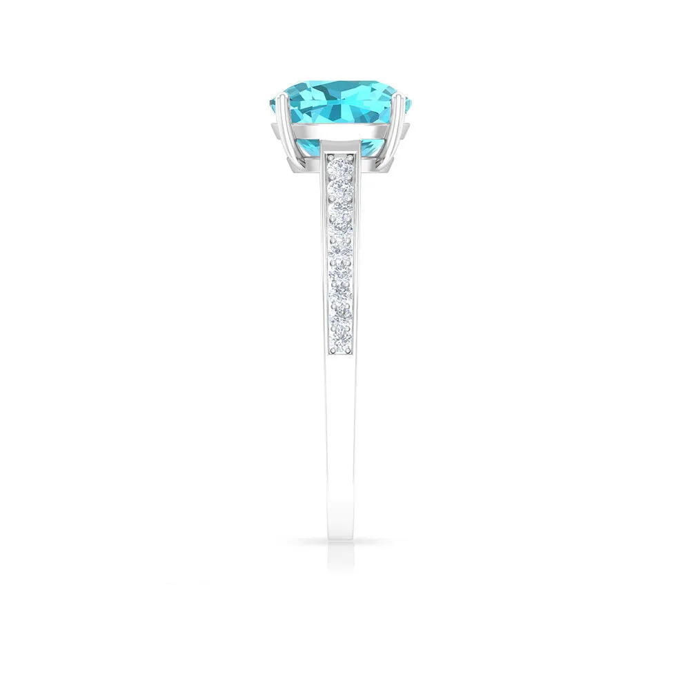 8.5 MM Cushion Cut Swiss Blue Topaz Solitaire with Diamond Side Stone Ring