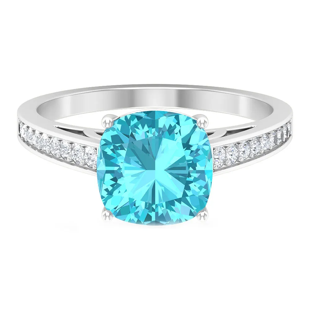 8.5 MM Cushion Cut Swiss Blue Topaz Solitaire with Diamond Side Stone Ring