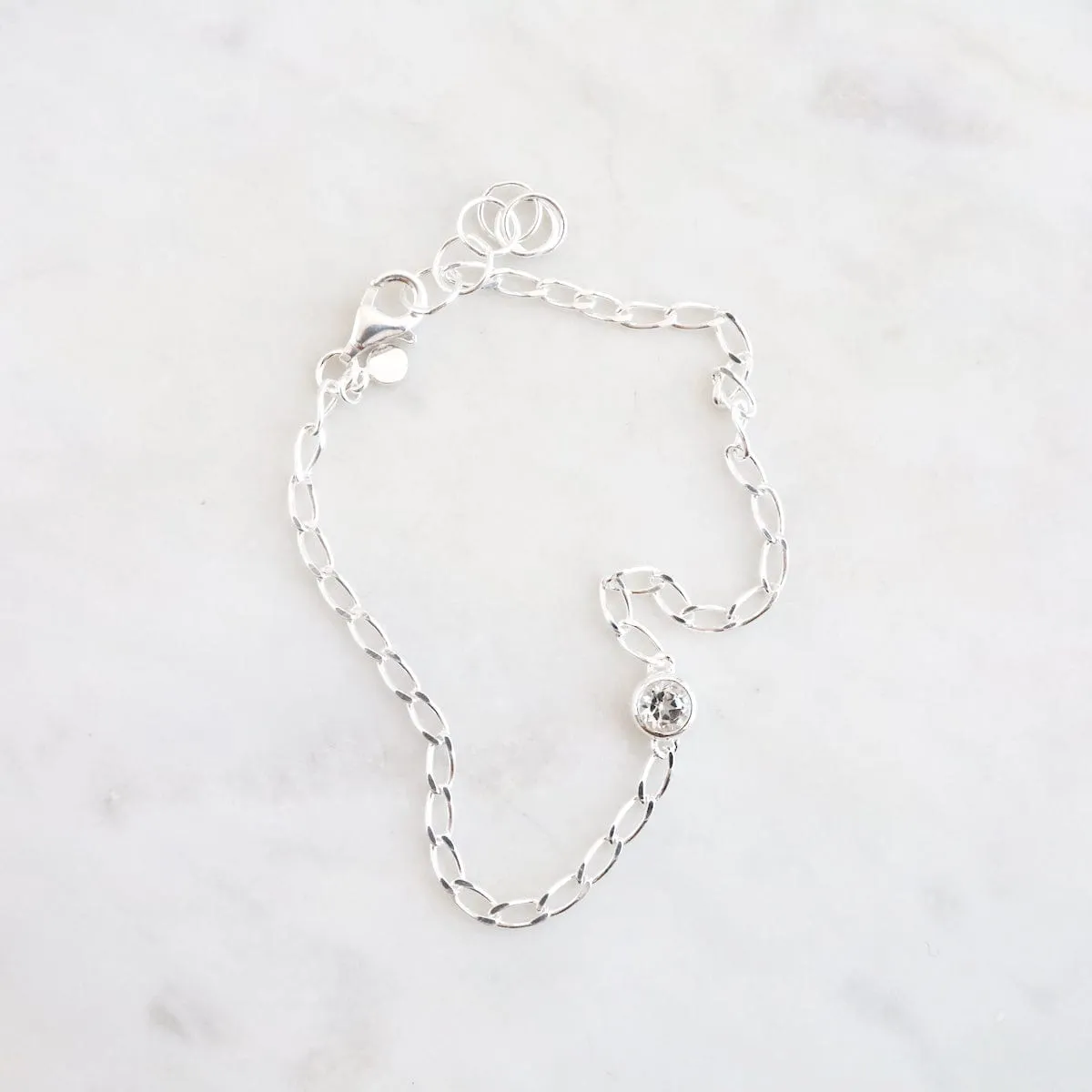 Fine Cut Curb Chain with Round Bezel Set White Topaz Bracelet